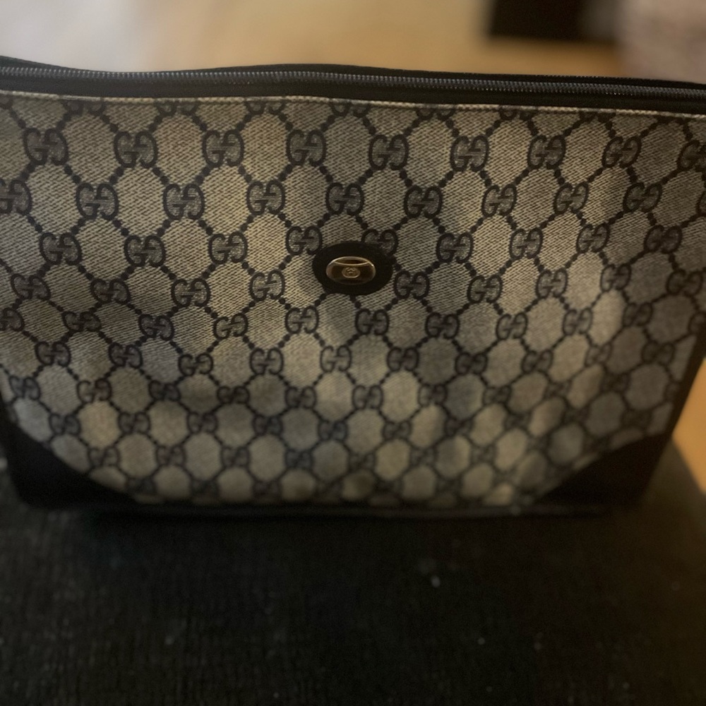 Gucci navy blue clutch.